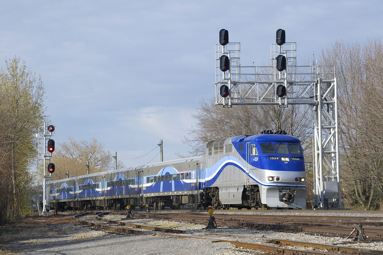 After makings its station stop at Lasalle Station EXO 76 is on the move again as it passes under a signal gantry.
