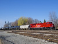 Freshly rebuilt CP 7033 brings up the rear of ethanol train CP 650.