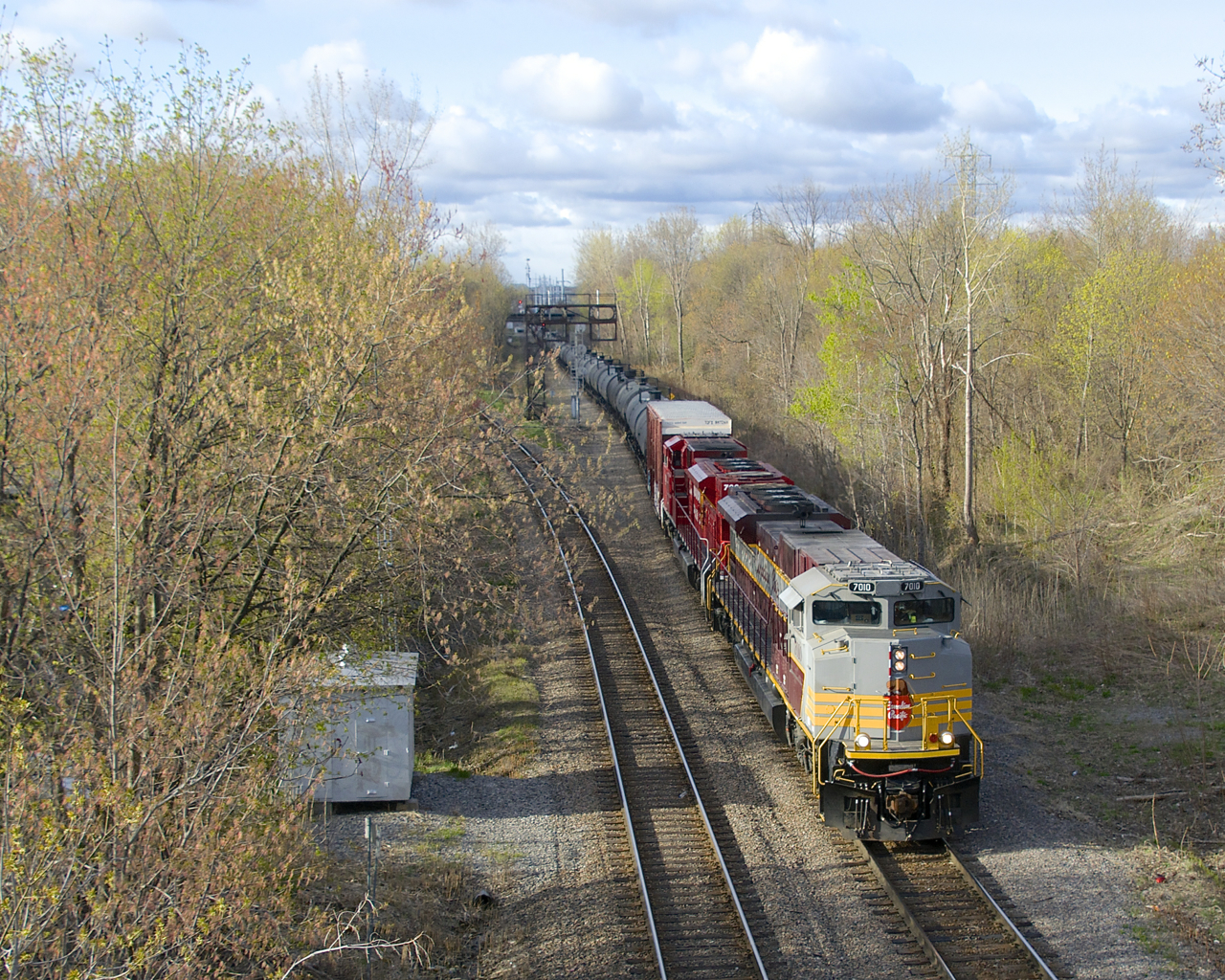 CP 253 with SD70ACU's CP 7010 and CP 7002 is passing North Jct on a cold morning.