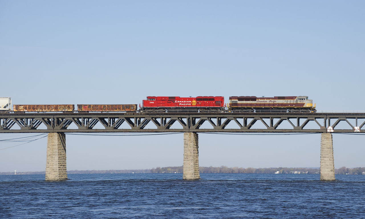 SD70ACU's CP 7010 and CP 7002 lead CP 253 over the St. Lawrence River. This is the second time in under a week that this pair power this train.
