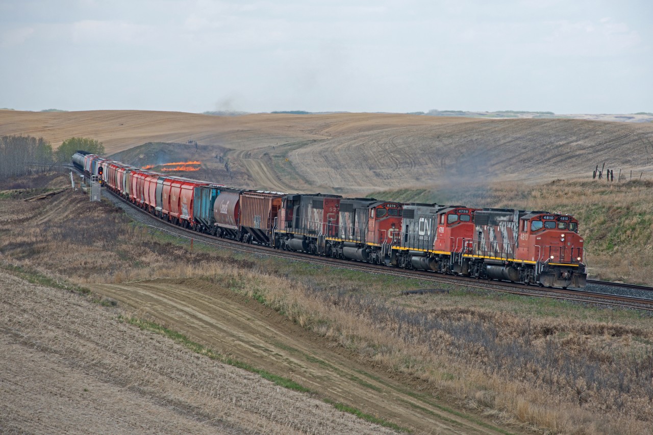 A HOT train...  CN 576 has quite a lashup, but there was little time to enjoy the sight as this train was lighting fires at an alarming pace, one of which can be seen in this shot.  It would light two more fires in the short distance between it and myself.