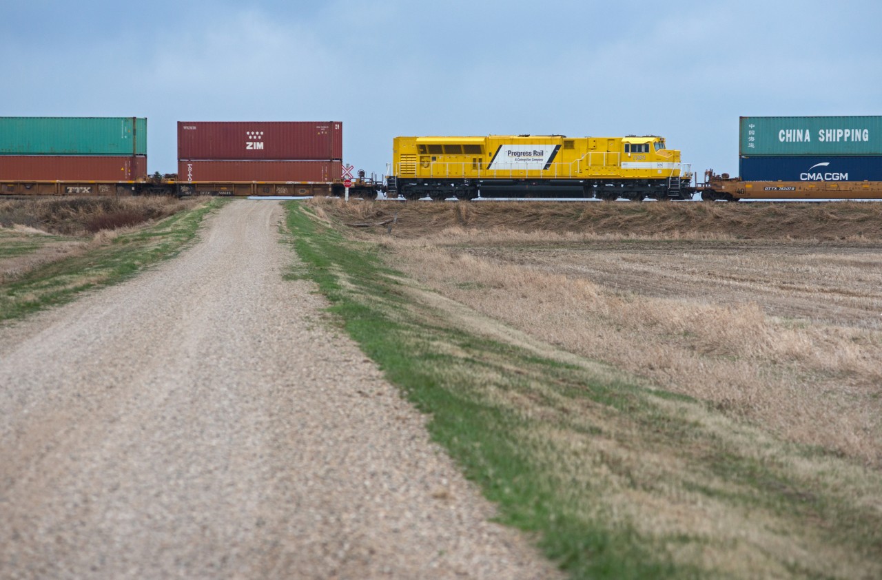 EMDX 7201 works it's way west through Landis Saskatchewan, mid-train on CN 119. In these days of "toasters" a-plenty, any variety is a welcome sight.