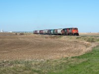 CN 540 has just finished lifting three loads at Rosetown after leaving Kindersley with eight loads and a reject, it is now headed Zealandia to lift another fifteen loads. 
