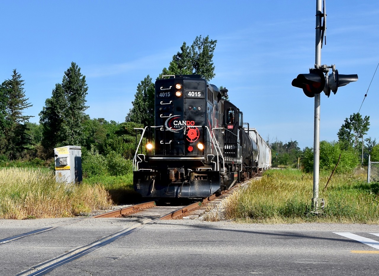 With engineer Steve Bradley pounding the throttle like any other Tuesday or Friday, 0839hrs on the Friday morning of June 29 2018 finds the very last ever regular freight run of the Orangeville Brampton Railway Short Line freight train under ‘CANDO’ making its way past the tiny town of Snelgrove, on approach to the major city of Brampton with 8 empty freight cars in tow from Orangeville Yard. Train is about to cross Mayfield road and if you look towards the end of the covered hoppers on the right you can slightly spot the Snelgrove siding/run-around track which is still used fairly often up to this day by the Trillium Railway (company which operates this short line today).  This was the last regular freight train here under CANDO because early in 2018, the CANDO rail company announced to the public that they made the buisness decision to permanently discontinue operations along the 36 mile Owensound Spur for personal company reasons and set June 30 2018 to be their last day of operations here. Word went around Ontario fast and many of us railfans wondered often about the fate of this short line at that time as as it was honestly quite possible for the 36 mile line to fall completely dormant after June 30th depending on how eager the Township of Orangeville was in terms of finding a new Short Line Operator to keep their railway active but lucky for us, they managed to connect with Trillium Railway in May 2018 and to this present day their mp15ac numbered 333 in Blue GATX paint still operates twice a week (mostly Tuesday’s and Fridays still) moving freight from the CPR Galt Sub in Mississauga, 36 miles north to the Township of Orangeville Ontario to service the last 6 customers along the 36miles left of the CPR Owensound Spur who rely of rail: 4 of which are in Orangeville and 2 more in Brampton.  * One last Fun fact, from what I’ve heard from locomotive engineer ‘Steve Bradley’ myself, back when he began OBRY operations in 2000 it was still only these exact 6 buisness’s who were using the rail back then. Havnt lost a single customer so far in just about 20 years (but excluding the Brampton Brick Place who Steve himself said he only serviced once very early in his era as by 2000 they had already found that using containers were the most efficient way for them with regards to shipping their bricks across the country by rail, their spur’s switch had been taken out by 2003).