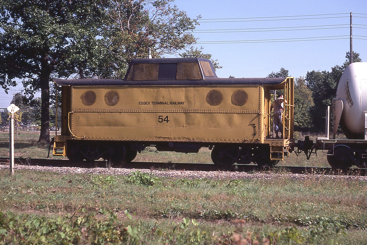 Here's a long ago shot of what I understand is the second caboose to be numbered 54 on the Essex Terminal Railway. This was previously part of the PRR fleet, as evident by those round windows. I'm unsure of the location of this shot along the railway, and also have no idea where this particular caboose ended up, and would appreciate help.