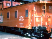 Another piece of equipment on display at the Elgin County Railway Museum during their <a href=http://www.railpictures.ca/?attachment_id=41108><b>Railway Days</b></a> was their restored Grand Trunk Western caboose, tucked away inside the museum's old Michigan Central RR shop building. 
<br><br>
GTW 77137 was originally built as Chicago & Grand Trunk 90724 by the GTR's Port Huron shops in 1891. The Canadian Trackside Guide shows it as donated and residing at the Bayview Museum in Sarnia from 1964-1974. It was reloacted to the Canadian Railroad Historical Association (Toronto & York Division) Canadian Railway Museum on the harbourfront in downtown Toronto near Queen's Quay and Bathurst, that opened in May 1975. When the harbourfront railway lines were removed from that area in the mid-late 80's, the equipment was removed and stored nearby in 1987 (some pieces found other homes, others were damaged by vandals, some were scrapped). The caboose was then moved to the Smiths Falls Railway Museum from 1990-1998 under private ownership, and eventually to the ECRM in St. Thomas where it resides today.