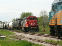 Throughout the Goderich-Exeter era on the Guelph Subdivision, train 516 from Stratford would regularly meet VIA Rail #85 in the small siding at Baden during the noon hour between switching customers between Baden and Stratford. However, after CN’s return in November 2018 there were no longer meets here during the afternoon as all the CN locals were now ordered out of Kitchener and L568 runs the same direction as 85. However, it should be noted that very occasionally L568 has met VIA Rail #87 here during the evenings on their return to Kitchener. 

However, a noon hour meet in Baden did occur at least once during 2019, as on one Friday morning CN L540 had to venture west to switch and lift a block of cars that had been previously set-off in the siding. Here, on a warm spring day, CN 4713 takes a break from switching and does a roll by inspection of 85 with 6408 west. 
