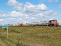 CN L501, with the 5275, drills the yard in Biggar on a lovely August morning in Saskatchewan. The facility in the background is Prairie Malt. I'd later find 501 out <a href="http://www.railpictures.ca/?attachment_id=39424" target="_blank">near Oban</a>, with a lone hopper in tow.