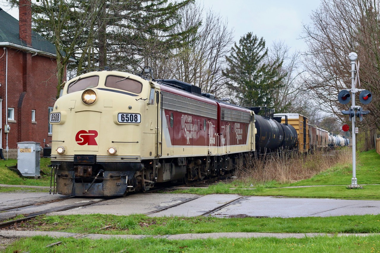Once the railroad capital of Canada, St. Thomas is certainly not the city it once was. Even for me, who missed out on the Canada Southern days it is sad visiting considering what I even witnessed since the 1990's. Fond memories of NS trains, CN locals, CP frame trains and Trillium. Today just about everything is gone. The large Ford plant in Talbotville has been disabled and most rails in the are have either been removed or sit rarely seeing a train. This past Thursday another loss came to the city when the OSR gave up operations over the Cayuga Subdivision. All that is left today is the once a day CN train out of London and OSR's train out of Ingersoll a couple times a week. All through trains are now distant history. The Cayuga Subdivision through town was once three tracks but today only one remains with the rest removed or disconnected after the loss of the locals. Here we see the last "Cayuga Clipper" heading back to the St. Thomas subdivision after the final run and lifting card a CN' s quiet yard in town. A matching set of F units certainly improves the mood of the day.