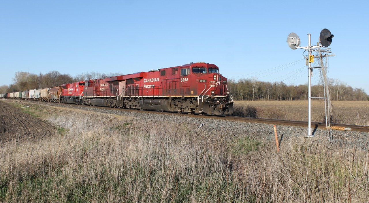 CP 8898 west is seen in the countryside roughly in the middle of Thamesville and Kent Bridge, Ontario. CP 7032 representing the third unit was DIT.
