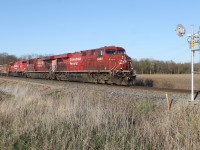 CP 8898 west is seen in the countryside roughly in the middle of Thamesville and Kent Bridge, Ontario. CP 7032 representing the third unit was DIT.