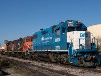 CN 394 sneaks by on number 1 track while 559 runs around their train before heading down the Peel Village Industrial Lead.