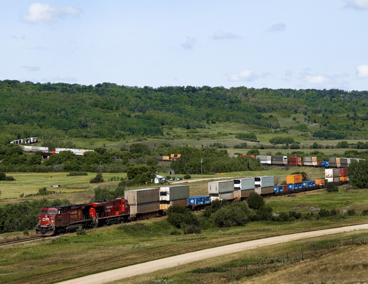 Edmonton to Toronto train 104 operating on CP's north line crosses the Assiniboine River valley on the tortuous Bredenbury Sub. with 3 valley crossings, Little Saskatchewan at Minnedosa, Birdtail at Birtle and the Assiniboine west of Binscarth. The Little Saskatchewan and Assiniboine involve 2% grades dubbing the subdivision Manitoba's mountain railroad. At the time CP couldn't make up its mind to operate this train via the north line or via Calgary and the main.