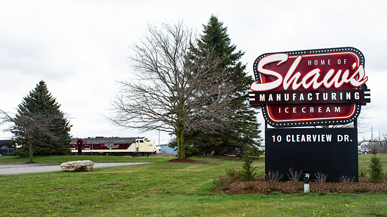 As of midnight on April 30th 2020 the CN Cayuga sub is now officially out of service between mile 114.55 (New Sarum) and mile 87.22 (Tillsonburg), with mile 87.22 to 80 (End of Steel in Delhi) seeing abandonment. Originally build by the Great Western Railway 147 years ago as a connection between Buffalo and the ferries in Windsor this line has seen many different owners over its existence to the likes of Wabash, N&W and CN. CN operated through trains up until roughly 1998 with NS through traffic (327, 328, 145 & 146) up until 1995. After 98 the future of the entire line was uncertain. From Delhi to Buffalo fell to the fate of abandonment and was torn up. In 2013 the St Thomas and Eastern (Trillium) took over the still CN owned line to service the industries between St Thomas and Tillsonburg. After 3 years of operation they did not find it profitable and OSR took over the business. Now after less then 4 years of running it, OSR too has found in not economically reasonable to continue service. With the few industries along the line, the fate of the "Canada Air Line" falls into the hands of CN. 

Here we see OSR's pair of matching F units roll out of Tillsonburg past the manufacturing facility of Shaw's Ice Cream.