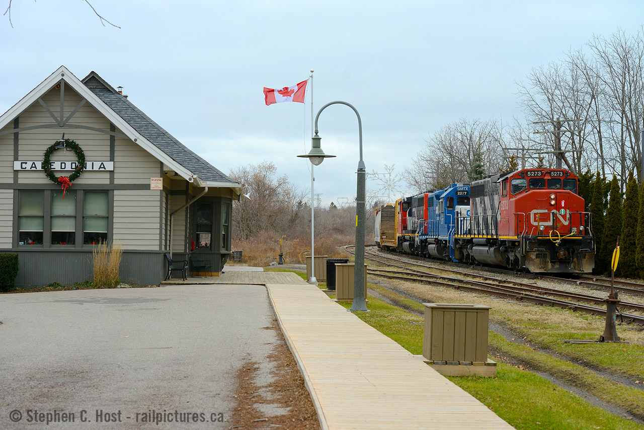 I've driven by this spot a few dozen times on the way to Port Dover, wishing that one day I might get lucky getting something here. Imagine my delight when chasing 5273 down the Hagersville they stopped to work Nicholson-Cates on the old CNR Dunnville sub allowing me to place the train beside the well kept GTR station. Built in 1908 it was the foresight of Ron Clark who bought the station to save it from demolition - and thank goodness he did - what a great job  Ron and the people of Caledonia have done, other communities would not be as lucky (ie: Ingersoll).