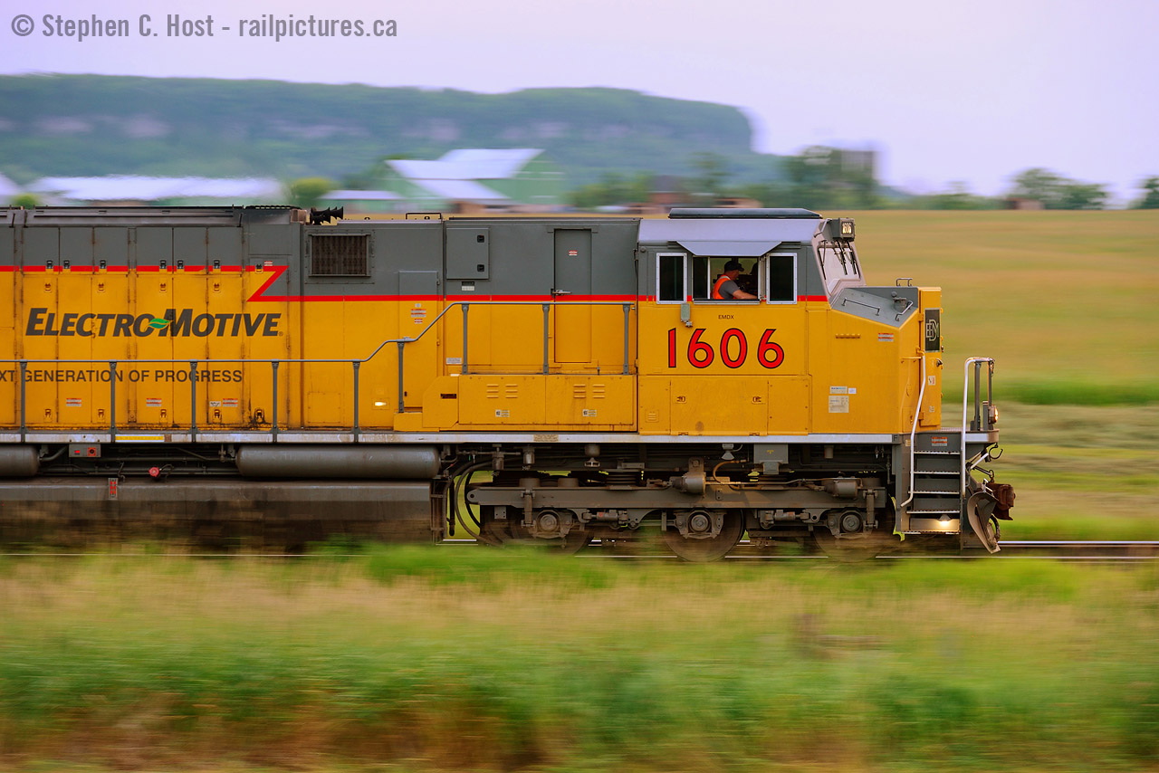The Next Generation of Progress has the helm of this eastbound reroute freight making good time up the grade on the Halton subdivision. The quaint rural scenes  between Burlington and Milton seem far away from the hustle and bustle of the Greater Toronto Area and are a nice place to take a break from it all. I love that you can get the Niagara Escarpment and nice farms in your photos, as seen in the background.
Will CN actually place a firm order for these Tier 4 demos? Will any of the new "Caterpillar yellow" demonstrators lead?