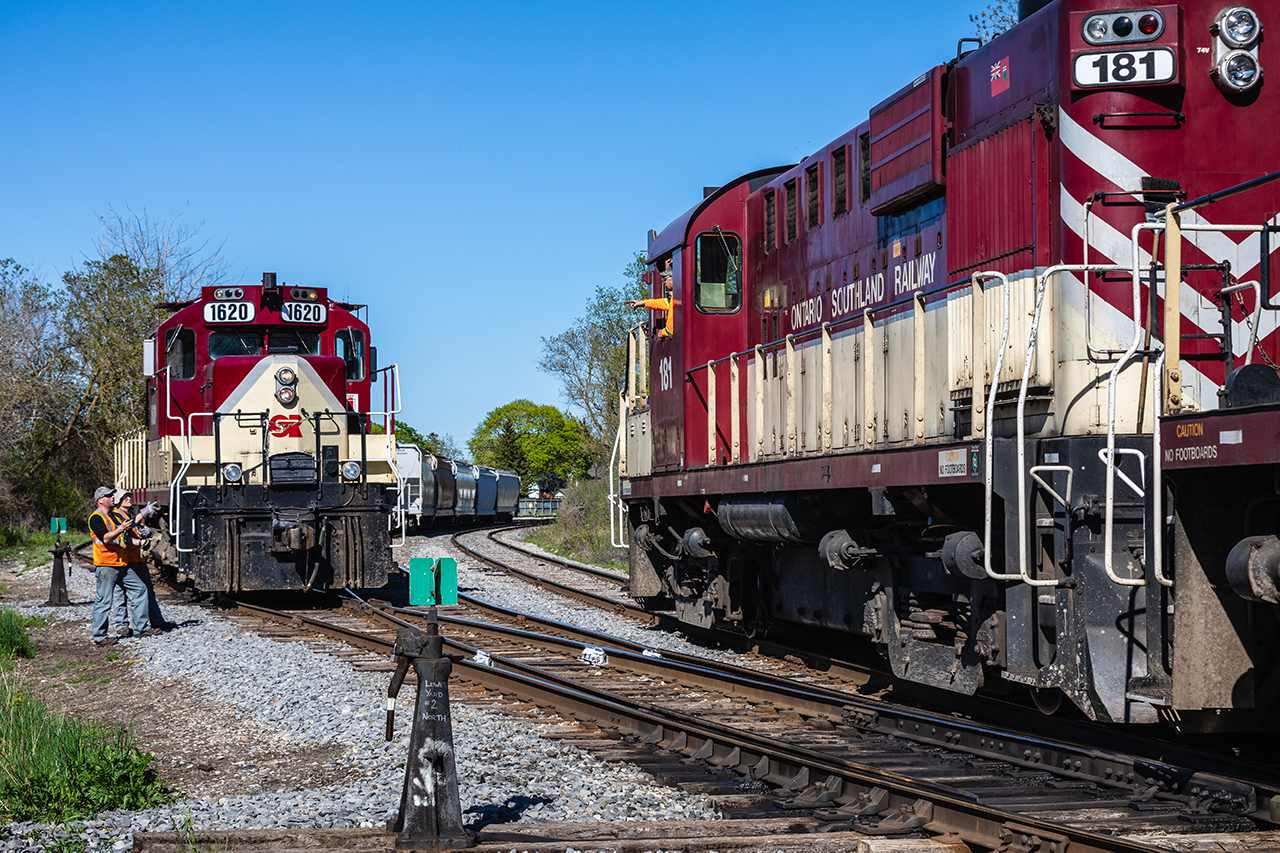 Ontario Southland’s days in the Royal City may be numbered, but it’s business as usual as a pair of trains meet at ‘Lower Yard’ on this gorgeous spring afternoon in Guelph, Ontario.