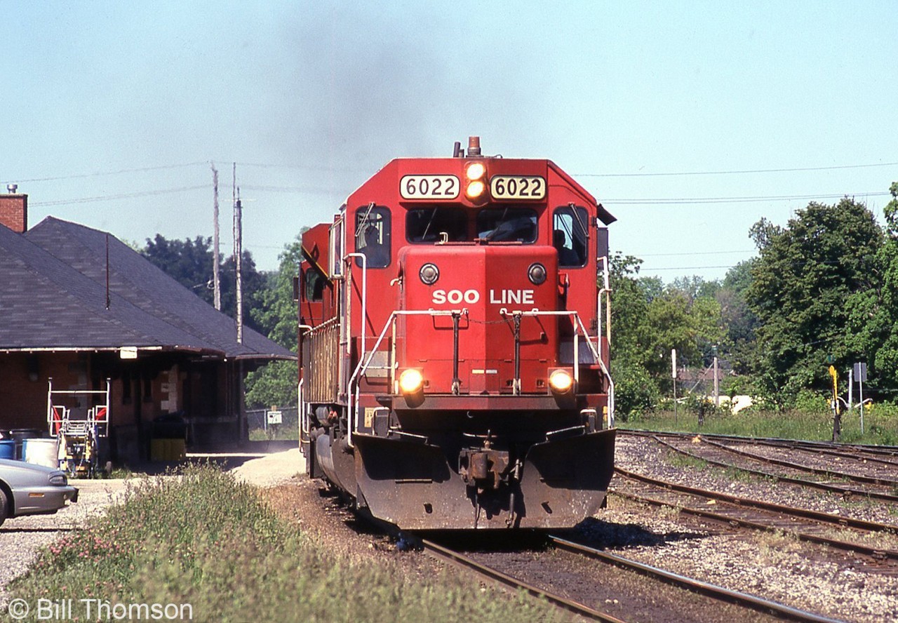SOO Line SD60 6022 heads up an eastbound CP freight past the station in Galt on a hot sunny day in May 2001. SOO power were common visitors on parent CP, notably their SD40-2 and SD60 units. CP eventually elected to overhaul and renumber the SOO SD60's as CP units, and SOO 6022 became CP 6222 in the early 2010's (CP still had many 6000-series SD40-2's that posed a numbering conflict).