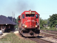 SOO Line SD60 6022 heads up an eastbound CP freight past the station in Galt on a hot sunny day in May 2001. SOO units were common visitors on parent CP, notably their SD40-2 and SD60's. CP eventually elected to overhaul and renumber the SD60's as CP units, and SOO 6022 became CP 6222 in the early 2010's (CP still had many 6000-series SD40-2's that posed a numbering conflict).