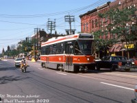 Back when the fledgling CLRV fleet was still relatively new on the Toronto transit scene, TTC CLRV 4023 heads eastbound on a Rt.506 Carlton run along the busy College Street, passing Major Street in traffic on a sunny afternoon in September 1983. Despite operating with front and rear couplers, the cars were never used in service as MU sets, and eventually the couplers were removed and replaced with front skirt pieces.
<br><br>
<i>William Madden photo, Dan Dell'Unto collection slide.</i>