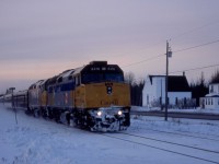 VIA Train 14 was running some six hours late as it speeds through Harcourt, New Brunswick, about 5 p.m. on a wintery Monday, March 7, 2005.   It is passing the deconsecrated Wesley Memorial United Church a few hundred yards north of the site of the CN station at Mileage, 24.4 of the Newcastle Sub. <br> <br>   

The Ocean, on its way to Halifax, Nova Scotia, had a healthy consist of F40-PH2s 6416 and 6426 with baggage car 8619, coaches 8139 and 8127, dome 8505, diner Louise, Chateau sleepers Laval, Marquette, Papineau, Viger, Radisson, Jolliet and dome observation Laurentide Park.  At Catamount, it would meet Montreal-bound Train 15, a Renaissance set behind units 6421 and 6413. <br> <br> 

The Newcastle Sub extends from Catamount 173.2 miles north along the east coast of New Brunswick, ending at the division point of Campbellton.  This route of the Intercolonial Railway linked Nova Scotia and New Brunswick to central Canada.  Its completion on Saturday, July 1, 1876, satisfied one of the conditions that had brought the eastern provinces into the Canadian confederation.  The Ocean began running on this route on Sunday, July 3, 1904, and had recently celebrated its 100th year of service as North America's longest continuously operating name train. 