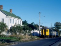 VIA Train 152,the Evangeline, is running alongside First Avenue as it departs Digby, Nova Scotia at, 8.30 a.m. in September 1989.   Just a few months away, on Saturday, January 13, 1990, the train would make its last run followed by its Sunday only counterpart, Train 154, to round out passenger service in Western Nova Scotia.  The train had departed Yarmouth, 86 miles west of Annapolis Royal at 7 a.m.; Digby was at Mileage 20.2 of the Yarmouth Sub.  The Train would cover another 151 miles before arriving in Halifax at 12.35 p.m. where it would make connections for Montreal, Sydney and other maritime communities. <br> <br>

The Western Counties Railway had completed a line from Digby to Yarmouth in August 1879.  In the early days, the Joggins, Bear and Moose rivers prevented the completion of a through-line to Halifax.  The Missing Link, as it was known locally, between Digby and Annapolis Royal, was filled by steamboats.  In 1890, the Missing Link was finally closed with federal financial assistance.  The Dominion Atlantic Railway purchased the Western Counties in 1893 and merged it with lines east of Annapolis Royal to provide a through route.  Ironically, the end of VIA service led to the railway's abandonment west of New Minas in April 1990.   Once again,  the Bear and Moose river crossings were expensive to taxpayers as they paid the cost of their removal in 2013. <br> <br> 

VIA 6221, was built in July 1956 (serial 6301) as MKT 20, their only RDC-3 although it lacked the customary RPO section.  The Katy purchased it to provide a connection from Wichita Falls, Texas, to their Texas Special train at Denison.  C&O acquired the car in November 1960, and it served as a backup to their two ex-M&StL RDC-4s along the Big Sandy between Ashland and Elkhorn City, Kentucky.   The B&O borrowed the car and, CN purchased it in August 1965 and renumbered it as D-356, later 6356.    VIA rebuilt the car as an RDC-2 and renumbered it 6221.   Industrial Rail Services of Moncton bought the car in 2000.  They could not find a buyer and scrapped the car in 2016. <br> <br> 