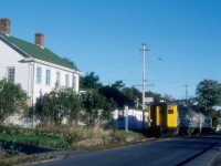 VIA Train 152,the Evangeline, is running alongside First Avenue as it departs Digby, Nova Scotia at, 8.30 a.m. in September 1989.   Just a few months away, on Saturday, January 13, 1990, the train would make its last run followed by its Sunday only counterpart, Train 154, to round out passenger service in Western Nova Scotia.  The train had departed Yarmouth, 86 miles west of Annapolis Royal at 7 a.m.; Digby was at Mileage 20.2 of the Yarmouth Sub.  The Train would cover another 151 miles before arriving in Halifax at 12.35 p.m. where it would make connections for Montreal, Sydney and other maritime communities. <br> <br>

The Western Counties Railway had completed a line from Digby to Yarmouth in August 1879.  In the early days, the Joggins, Bear and Moose rivers prevented the completion of a through-line to Halifax.  The Missing Link, as it was known locally, between Digby and Annapolis Royal, was filled by steamboats.  In 1890, the Missing Link was finally closed with federal financial assistance.  The Dominion Atlantic Railway purchased the Western Counties in 1893 and merged it with lines east of Annapolis Royal to provide a through route.  Ironically, the end of VIA service led to the railway's abandonment west of New Minas in April 1990.   Once again,  the Bear and Moose river crossings were expensive to taxpayers as they paid the cost of their removal in 2013. <br> <br> 

VIA 6221, was built in July 1956 (serial 6301) as MKT 20, their only RDC-3 although it lacked the customary RPO section.  The Katy purchased it to provide a connection from Wichita Falls, Texas, to their Texas Special train at Denison.  C&O acquired the car in November 1960, and it served as a backup to their two ex-M&StL RDC-4s along the Big Sandy between Ashland and Elkhorn City, Kentucky.   The B&O borrowed the car and, CN purchased it in August 1965 and renumbered it as D-356, later 6356.    VIA rebuilt the car as an RDC-2 and renumbered it 6221.   Industrial Rail Services of Moncton bought the car in 2000.  They could not find a buyer and scrapped the car in 2016. <br> <br> 