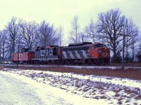 A CN F7A and GP9, both with snow shields, lead PSC caboose CN 79214 on the Guelph sub.<br><br>
There's a strong possibility they are going to (or from) CN Stratford, base for plowing the lines to Goderich and Exeter.
 
