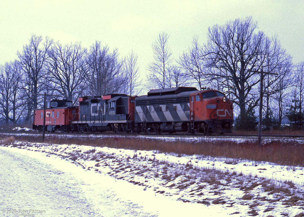 A CN F7A and GP9, both with snow shields, lead PSC caboose CN 79214 on the Guelph sub.
There's a strong possibility they are going to (or from) CN Stratford, base for plowing the lines to Goderich and Exeter.
