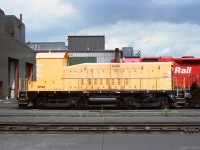 CP 6195 was a remote-control switcher, seen at the Alyth Diesel Shop in Calgary.<br>
It was a GMD SW900 originally built as CP 6716 in 1955, rebuilt to CP 6195 in 1991.<br>
Visible modifications included covering all cab windows and this high-viz paint scheme.<br>
CP disposed of it in 2003.
