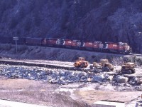 <br>
<br>
 ….SD40's and SD40-2's: doing what they were designed for.....
<br>
<br>
 ...exact location is unknown....need help with this...anyone?
<br>
<br>
  ….this may be the MacDonald Tunnel construction site....given the date....east or west portal?
<br>
<br>
  ….four SD's and CP Rail Dynamometer car: 5817 / 581x / 5834 / 5943 / 62* ….
<br>
<br>
 In the Selkirk Range ,  May 1984 Kodachrome by John Baker, collection of Steve Danko 
<br>
<br>
 more John Baker Kodachrome
<br>
<br>
<a href="http://www.railpictures.ca/?attachment_id= 36715">  at the spirals   </a>
<br>
<br>
<a href="http://www.railpictures.ca/?attachment_id= 41447">  Lake Wapta   </a>
<br>
<br>
 <a href="http://www.railpictures.ca/?attachment_id= 36814">  GMD1   </a>
<br>
<br>
 What's interesting:
<br>
<br>
 per Trackside Guide * Dynamometer Car #62 is owned by the National Research Council, lettered CP Rail.
<br>
<br>
sdfourty
