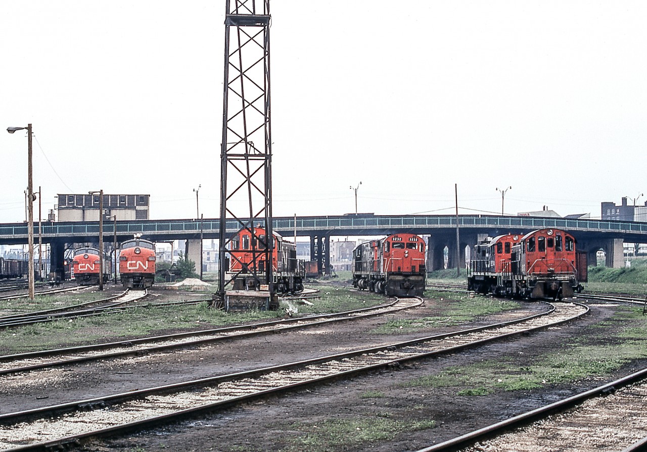 It's a gloomy June 13, 1972 at CN's Spadina engine facility in Toronto. CN 3232 is the only locomotive whose number can be read.