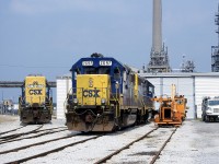 I thought this was a pretty standard-issue photo angle in Sarnia unit I looked at the aerial.  I don't think I'd venture this far off the public road for a shot nowadays.  Looking every bit like a shortline railroad's shop, the CSX shop area is quite quaint even if the industrial area surrounding it is far from it. Train D724 has just finished their work and CSXT 2697 and 2561 have been parked in front of the shop to wait for their next assignment.  The "bright future" paint scheme sure looks good now that the drab "dark future" scheme has taken over.  Chessie was better, but you've got to take what you get.  