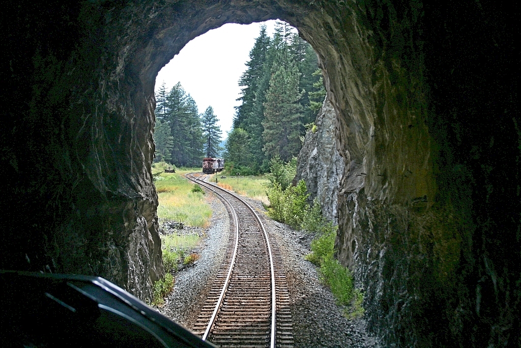 Light at the end of the tunnel and thank goodness the headlight at the other end was extinguished and in the siding. A muggy July afternoon southbound on the Rocky Mountaineer "Fraser Discovery" exiting the 3800 foot long Shalalth tunnel on the BC Rail Squamish subdivision. We are approaching the north siding switch at Seton siding, our meet was "in the clear". This being "dark territory" OCS we would have a restriction(s) at the south siding switch to "restore to normal" "do not proceed until XXXX north arrives at", identify the train we were meeting, restore the switch and then we would proceed to our final destination at Whistler.