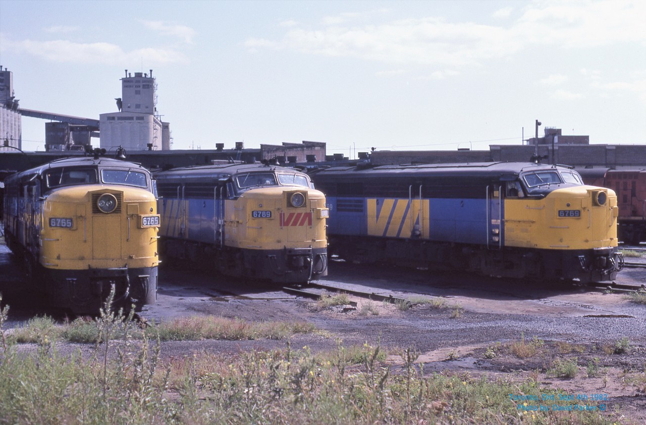 Who's on third?  A trio of VIA FPA-4's 6765-6789-6769 await their next assignment at the Spadina roundhouse in downtown Toronto on August 4th 1982. The approximate location of third base at Skydome, er sorry, I mean Rogers Centre today.