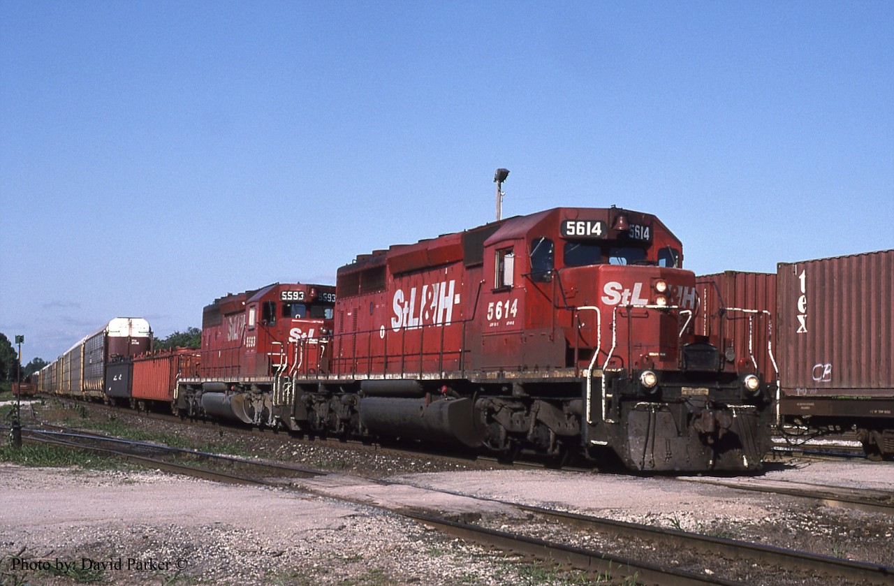 A pair of STL&H SD40-2's (5614-5993) head train #138 through Guelph Jct, Ont on Aug 18th 2002.