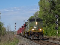 CP 2-421-24 hauls westbound through Leaside with CP D-Day commemorative locomotive 6644 leading the way. CP 8938, CP 3119, and CP 3134 trail. The 2 GP38-2s were dropped in Spence. 