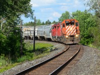 A short train of interchange traffic from the GJR at Campbellville rounds the bend at Concession 14 east of Puslinch Siding doing nothing but track speed with original painted 3018 in lead. The good old CP situation brings sun for 1 minute, then clouds for 5 minutes and on and on and on yeah you get it. Thankfully, they were cleared to B/E CTC Sign Ayr from Gue Jct as the thick clouds broke apart so it was very ideal for my first time seeing this lead since the start of it’s assignment in London. The “action red” paint as well as the stripes on 3018 is a fantastic change to the usual CP paint schemes you see out of London for this job and knowing it was facing west and will lead the correct way at the correct time of day for light, I had to finally put the effort in to shoot this job again