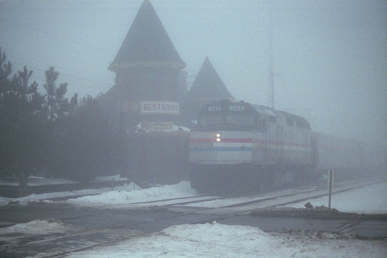 Everyone is out enjoying the beautiful weather these days; and for some asinine reason I thought this might be a good time to offer up an image taken in just about the lousiest weather imaginable. So here is Amtrak 348, eastbound on the Grimsby Sub as train #97, stopped at the old CN station at Ontario St in Grimsby. Damp, cold and downright miserable. Some days I wondered why I bothered.........