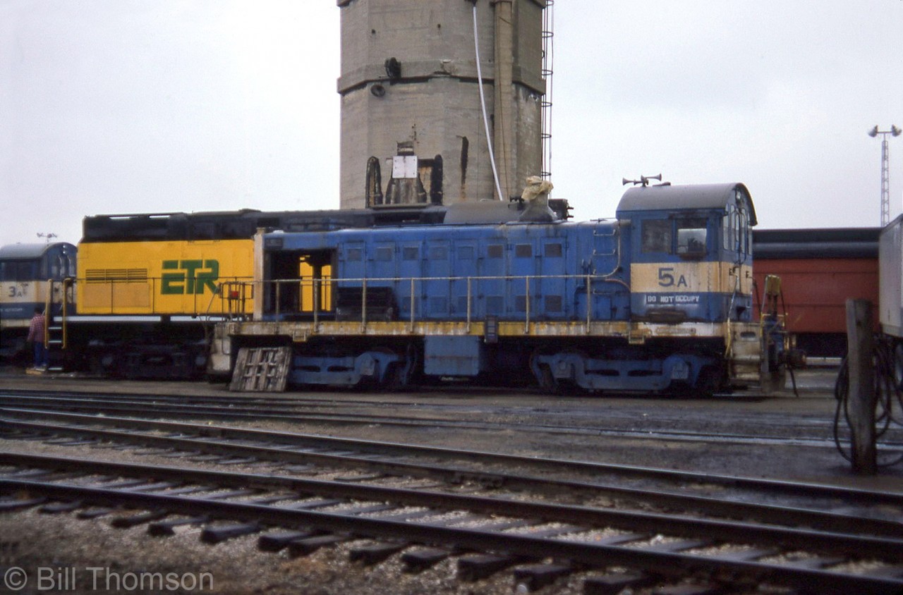 Two Allied Chemical Alco S4 switchers are shown at the Essex Terminal Railway's shops in Windsor in April 1987, by ETR's own C420 106. Shown are: Allied Chemical 5A (nee B&O 9001) and 3A (nee B&O 9113).

Rosters list these formerly at Allied's Solvay NY plant, and stored on the ETR in 1987/1988 before being put into service at Allied's plant in Amherstburg, Ontario (that became General Chemicals). 3A would be kept for parts, while 5A would become B12 and put into service.
