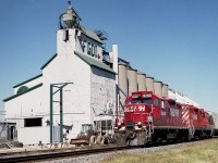 Okay....so this place is Arkwood, is it? I appreciate that information because I didn't know and put down Louisville, which I guess is slightly farther south-east.
Seeing some RP contributors getting credit for shooting here, I thought I had better add my name, indirectly, to the list. :o) Westbound with one car is STLH 8206 and CP 8231. The sidekick of the day, after some coaching, pulled off this not-too-bad a shot, while I elected to get close in on the action. We expected a mainline freight, you know, like a couple of SOOs up front or something. Wishful thinking I guess. And so I elected to try a "down the line" shot, and I get rewarded with this little puddle-jumper. Got a wave from a friendly engineer though; you can see me up on top of the hopper.:o)