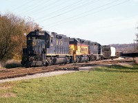 It is already getting on in the afternoon as the first Nanticoke train over the TH&B using Chessie power puts his train together at the west end of Aberdeen Yard by Stroud Rd. One of the difficulties in following this train on its way to Brantford and down toward Waterford on the old TH&B Waterford sub was the fact it often left Aberdeen even later than this; resulting in a real problem with shadows in the low sun. But sometimes, like today, we got lucky. Power is B&O 4815, C&O 3885 and 4828. I'm using an old K-1000 Pentax and this is from negative film, not a slide.