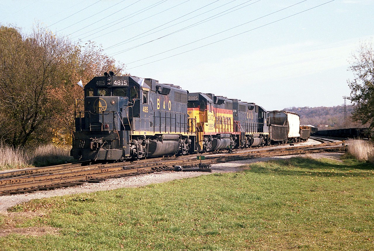 It is already getting on in the afternoon as the first Nanticoke train over the TH&B using Chessie power puts his train together at the west end of Aberdeen Yard by Stroud Rd. One of the difficulties in following this train on its way to Brantford and down toward Waterford on the old TH&B Waterford sub was the fact it often left Aberdeen even later than this; resulting in a real problem with shadows in the low sun. But sometimes, like today, we got lucky.  Power is B&O 4815, C&O 3885 and 4828. I'm using an old K-1000 Pentax and this is from negative film, not a slide.