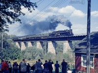 With railfans and townsfolk below, CNR 6218 blasts over the "London Bridge" atop Trout Creek, making it's runpast towards the station at St. Mary's Ontario during an excursion trip.  Now on display at Fort Erie, the 6218 has been receiving long overdue restoration efforts from the city, with plans to eventually erect a cover over the locomotive and caboose.