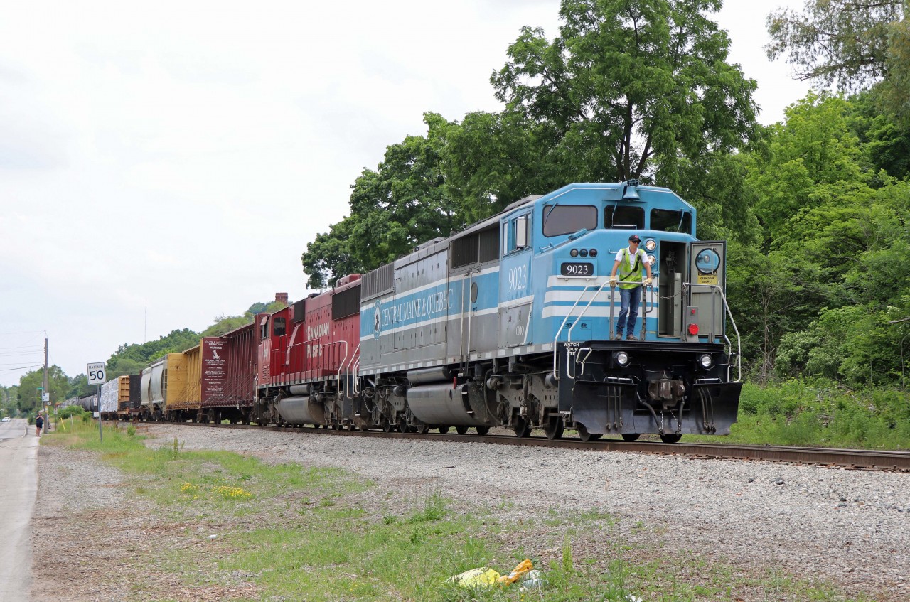 You can almost hear what the Conductor is thinking above the noise of the locomotives..."Not those guys again!"

Many were out after 247 today with its CMQ/former (and again) CP SD40-2F and former SOO SD60M consist (9023 and 6260)...As one of the guys said, "Are you chasing it?" (Unfortunately no---duty (work) calls...)