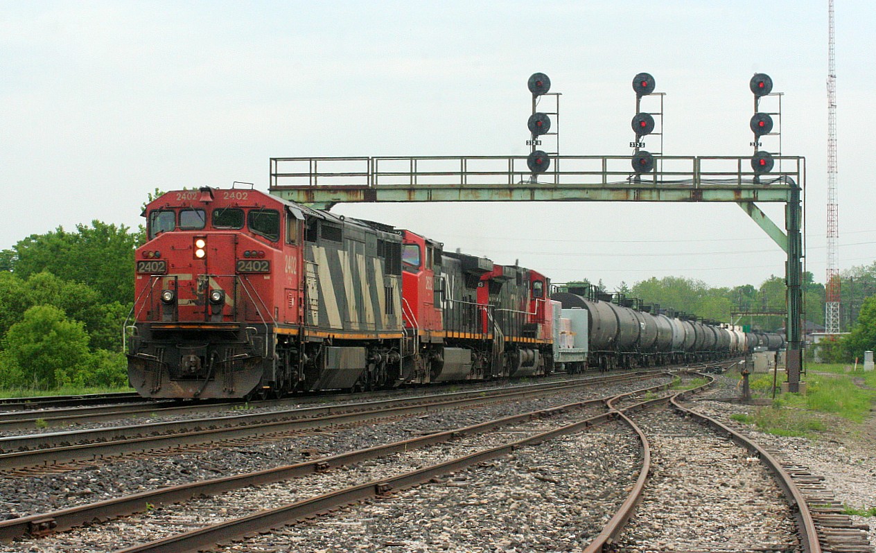 CN 385 with 2402, 2632 and 2513 heads westward through Paris to work at Paris West after following the weed spraying train 999. It appears I should have followed this train west at the time....