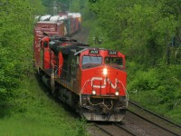 CN 2658 is leading an eastbound as it curves through Paris, Ontario on the Dundas Subdivision seen from the John Street bridge. This is still a great location for eastbound photos, however the vegetation has grown in considerably over the years. 