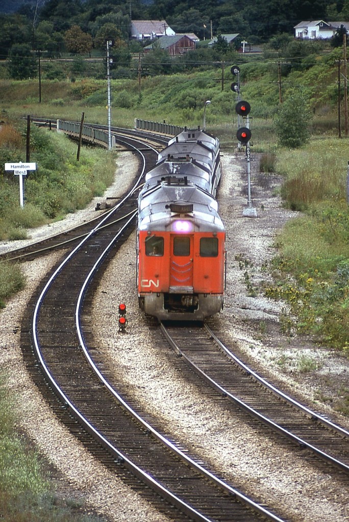 Nice old shot of the eastbound Budds coming down the hill from London back in the days before VIA was formed. I still think this concept was a great 'people mover' and do not understand with all the technology we have today that there are no modern versions of this rail diesel car in production. Pity I took no notes as per numbers...