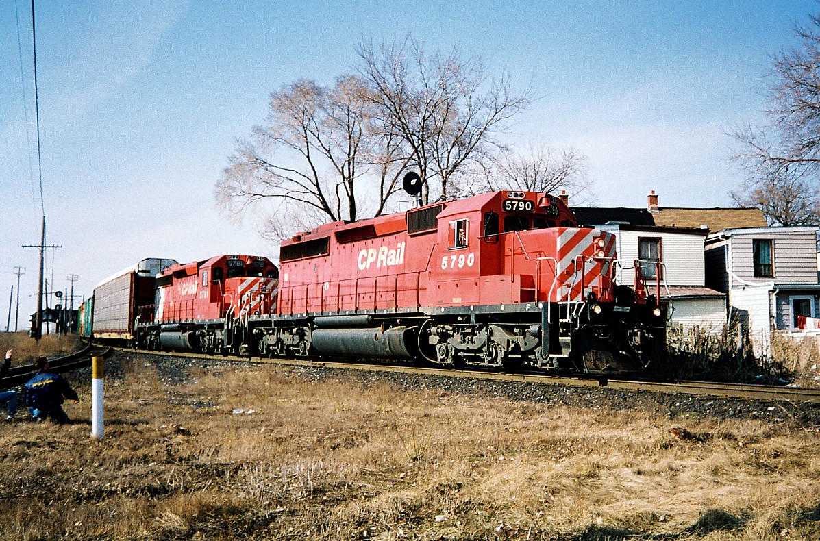 A southbound 400-series train is at West Toronto about to complete it's journey on the MacTier Subdivision before entering the North Toronto Subdivision to Toronto yard. The consist included; SD40-2's 5790 and 5781, with the trailing unit in the big multi-mark scheme.