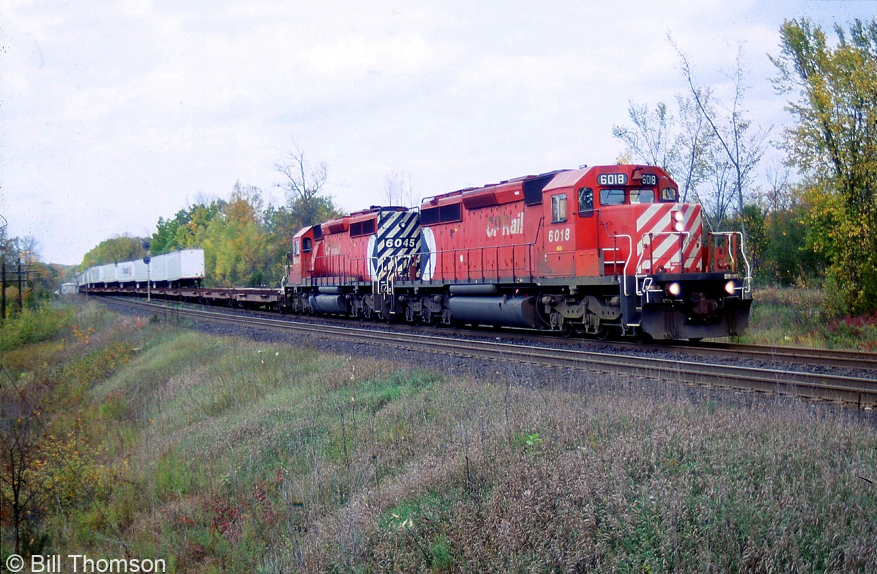 CP SD40-2's 6018 and 6045 head up the westbound Expressway at Roblindale (Mile 68.7 of CP's Belleville Sub) in October 2005. SD40-2 power was common on the Expressway, initially 5660- and 5740-series SD40-2's (including specially branded units 5742 and 5745), and later even pairs of SD40-2F's.